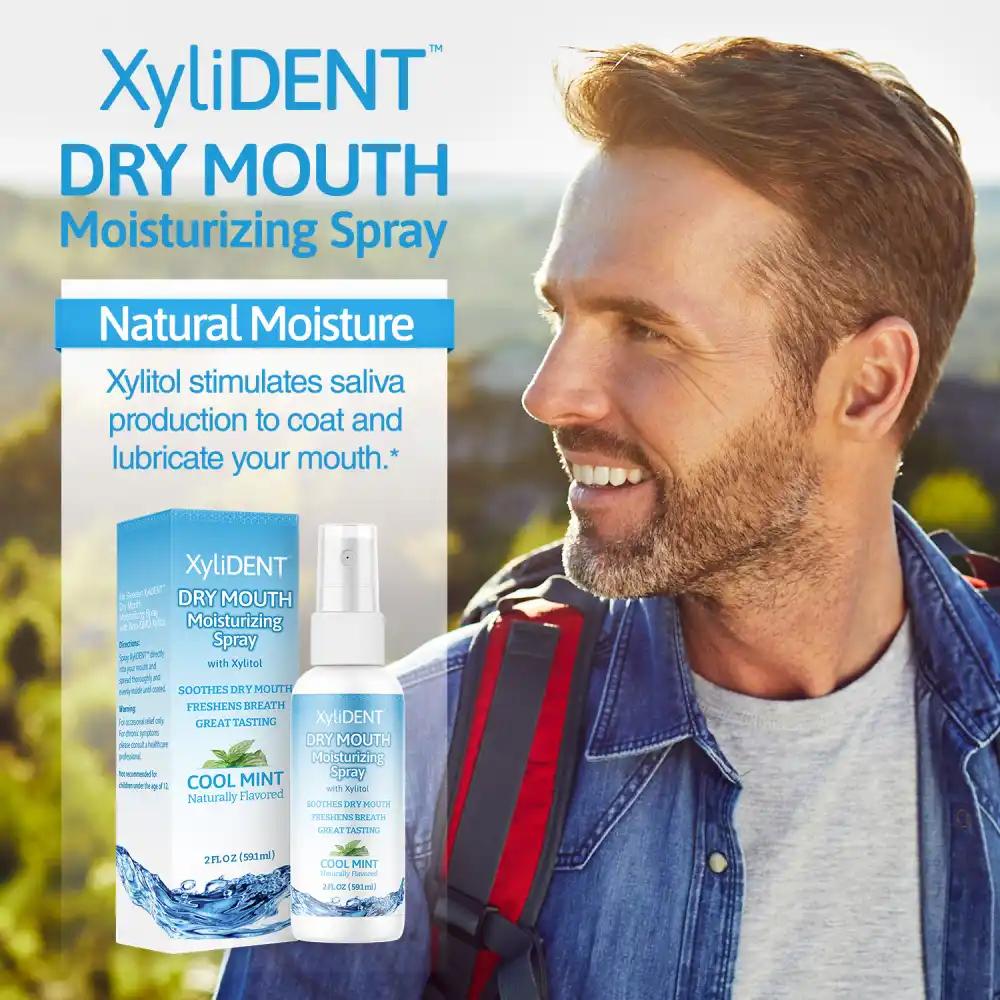 image of a man in nature with backpack and description with the benefits of xylitol moisturizing mouth spray for dry mouth by XyliDENT with Cool Mint flavor in bottle 59 ml | For website: healthychewinggum.com | Source: XyliDENT