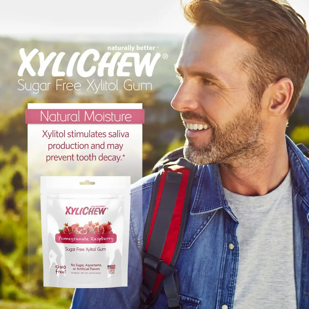 an image of a man in nature with a backpack and a description and photo of xylitol Pomegranate Rapsberry chewing gum in a bag pack of 50 chewing gums from the manufacturer Xylichew without aspartam (aspartam free) | For website: healthychewinggum.com | Source: Xylichew