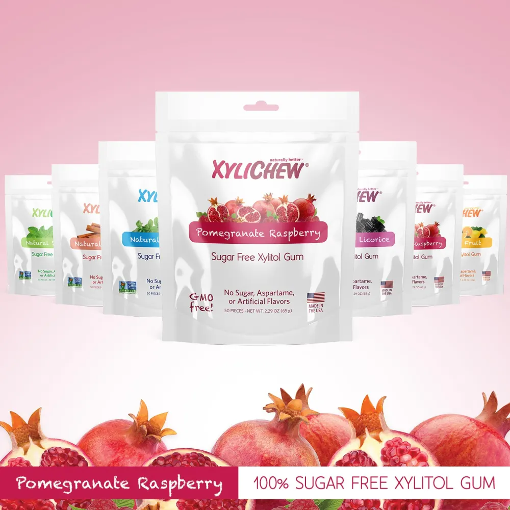 image with multiple flavors of Xylichew xylitol chewing gum in the foreground Pomegranate Raspberry flavored xylitol chewing gum without aspartame in a bag of 50 | For website: healthychewinggum.com | Source: Xylichew