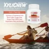 picture of a man and a woman canoeing on a lake in the lower part and in the upper part a description of xylitol Cinnamon chewing gum in a bottle with 60 chewing gums from the manufacturer Xylichew | For website: healthychewinggum.com | Source: Xylichew