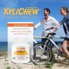 picture of man and woman with bicycles walking by the beach and a description with the benefits of chewing gum and a photo of xylitol Fruit chewing gum in a bottle pack of 60 chewing gums from the manufacturer Xylichew | For website: healthychewinggum.com | Source: Xylichew