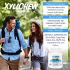an image of man and woman in nature with a backpack and a description and photo of xylitol Peppermint chewing gum in a bottle pack of 60 chewing gums from Xylichew aspartam free | For website: healthychewinggum.com | Source: Xylichew