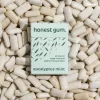 picture of Eucalyptus Mint All Nature Chewing Gum from honest gum in a flip box from the front on a background of chewing gum | plastic free, sugar free, sustainable and aspartam free | For website: healthychewinggum.com | Source: honest gum