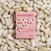 picture of Fruit All Nature Chewing Gum from honest gum in a flip box from the front on a background of chewing gum | plastic free, sugar free, sustainable and aspartam free | For website: healthychewinggum.com | Source: honest gum