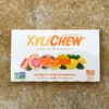 Detail of Fruit chewing gum from the front - Xylichew gum with rubber base without plastic materials (no plastic) on yellow background | For the web: healthychewinggum.com | Author: Jiri Samuel