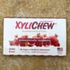 Detail of Pomegranate Raspberry chewing gum from the front - Xylichew gum with rubber base without plastic materials (no plastic) on yellow background | For the web: healthychewinggum.com | Author: Jiri Samuel