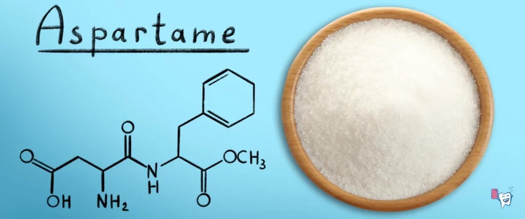 Below the title "Aspartame", the chemical formula of Aspartame is given and alongwith this, there is its powdered form placed in a petri dish | For article: Aspartame-free Chewing Gum | For website: healthychewinggum.com | Source: shutterstock