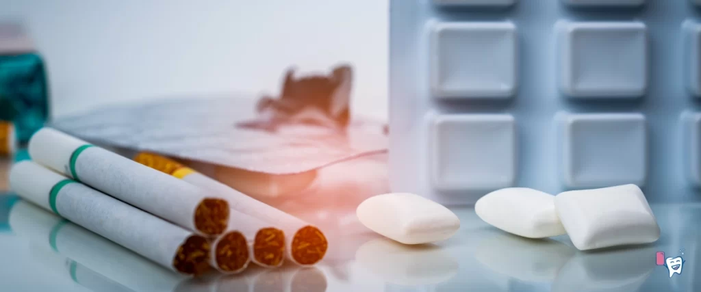 The image shows a bunch of chewing gums alongside a bundle of cigarettes | For article: The Best Way to Brush Teeth | For website: healthychewinggum.com | Source: shutterstock