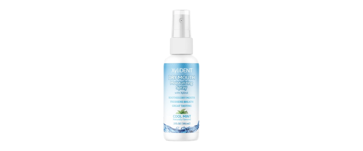 Moisturizing spray for dry mouth and dry cough by XyliDENT brand - purely natural composition without harmful chemicals on a transparent background in a white bottle with a blue and white sticker with text | For page: About us | Created for: HealthyChewingGum.com | Edited by: Jiří Samuel | Original source: XyliDENT (manufacturer)