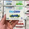 Xylichew peppermint chewing gum in a blister holding in the left hand in the background with other blisters with other flavours